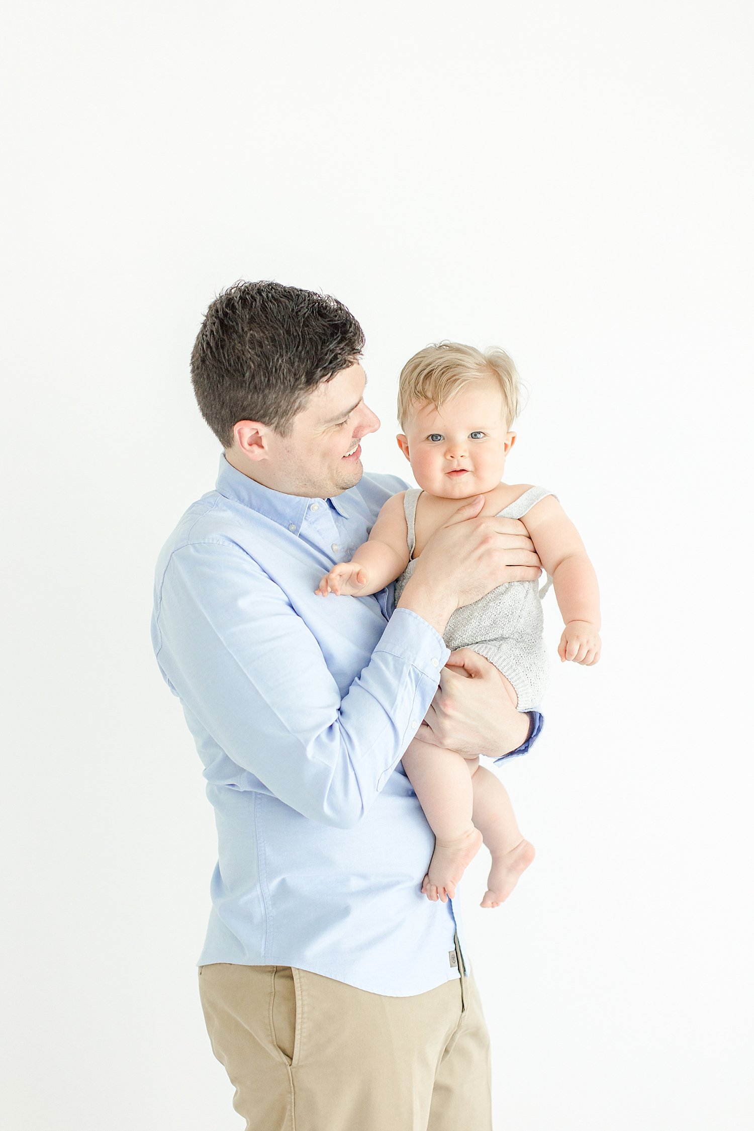 Father-son photos during milestone session with Kristin Wood Photography.