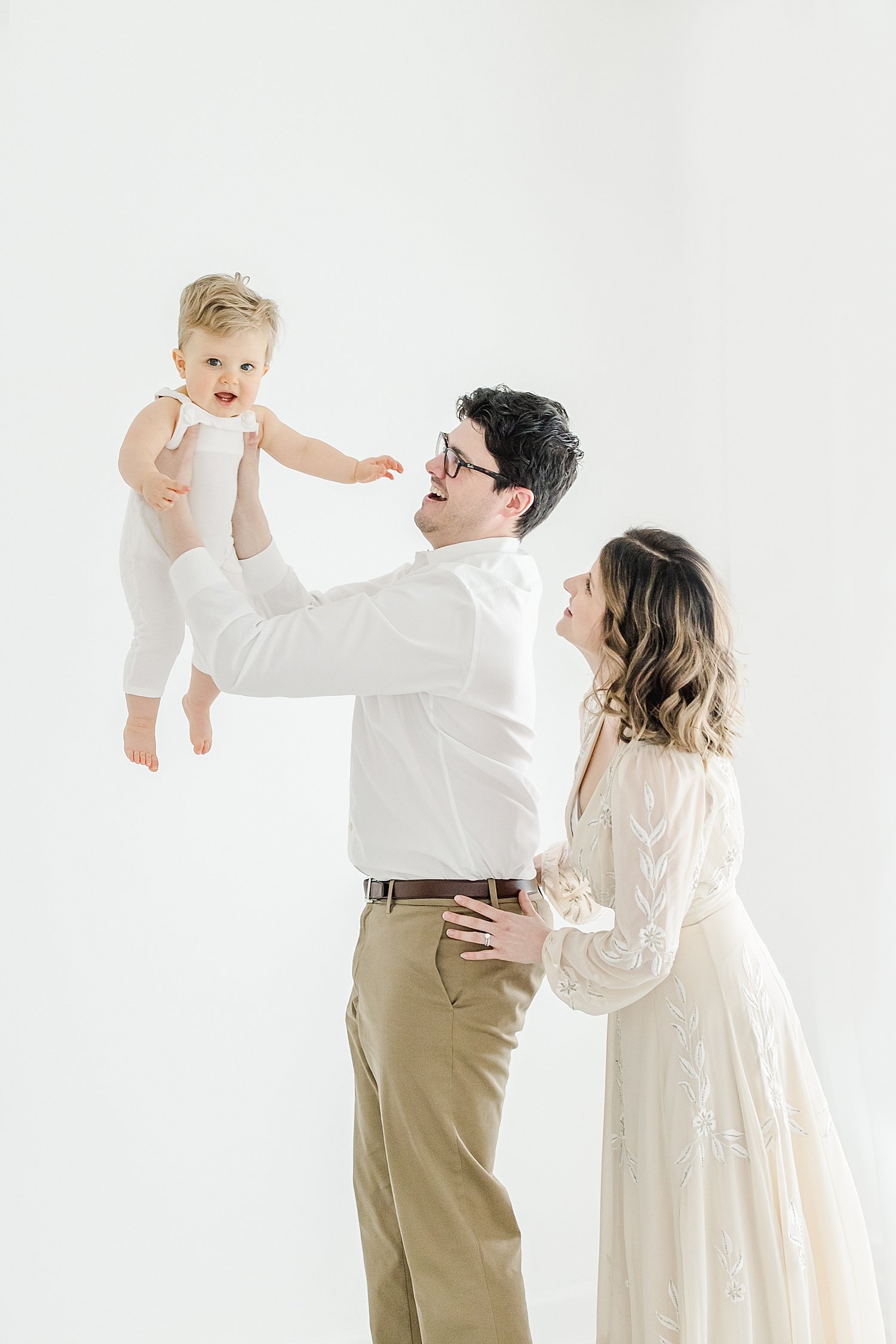 Parents with son during first birthday photoshoot with Kristin Wood Photography.