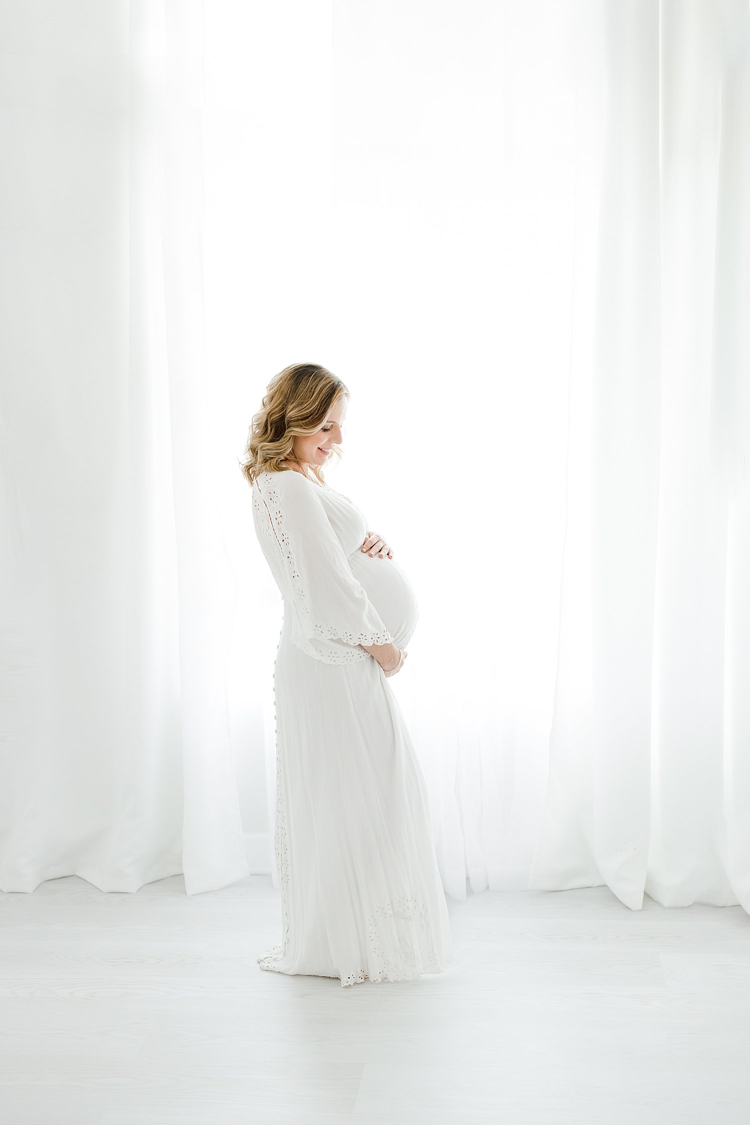 Pregnant mom in long white dress for maternity photos | Kristin Wood Photography