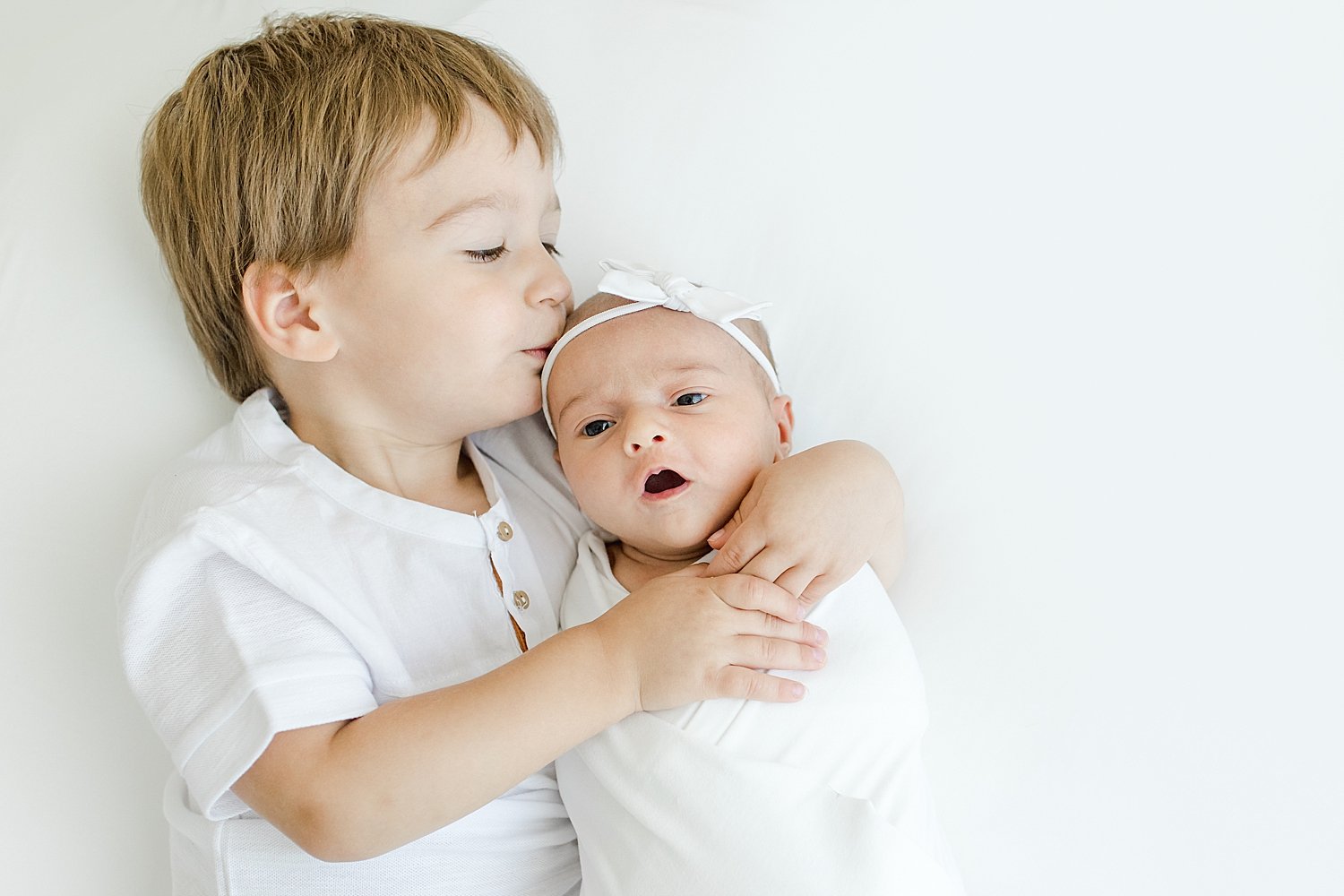 Sibling photos during newborn session in Westport, CT studio | Kristin Wood Photography