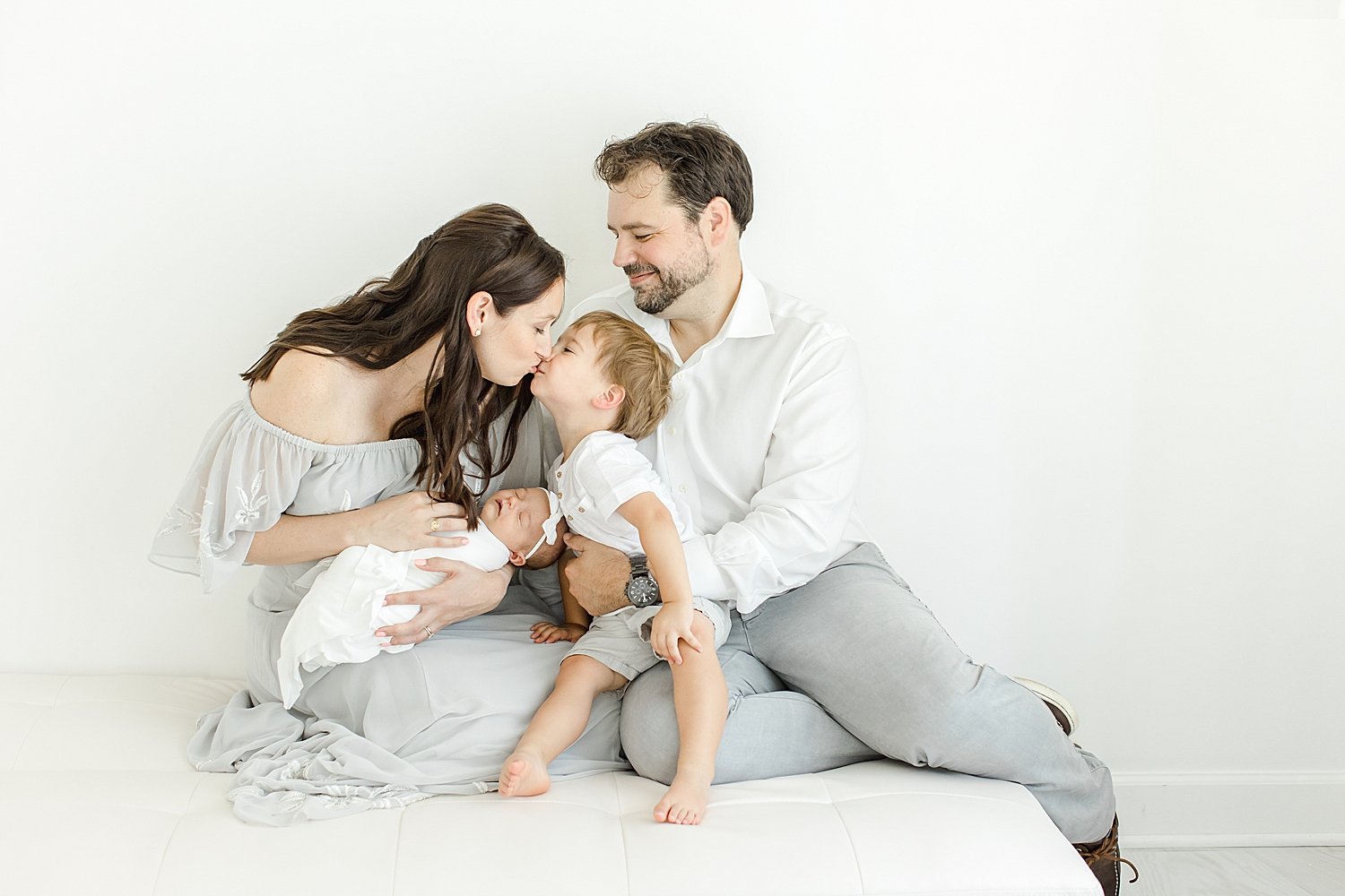Sweet family moment during newborn session for second baby | Kristin Wood Photography