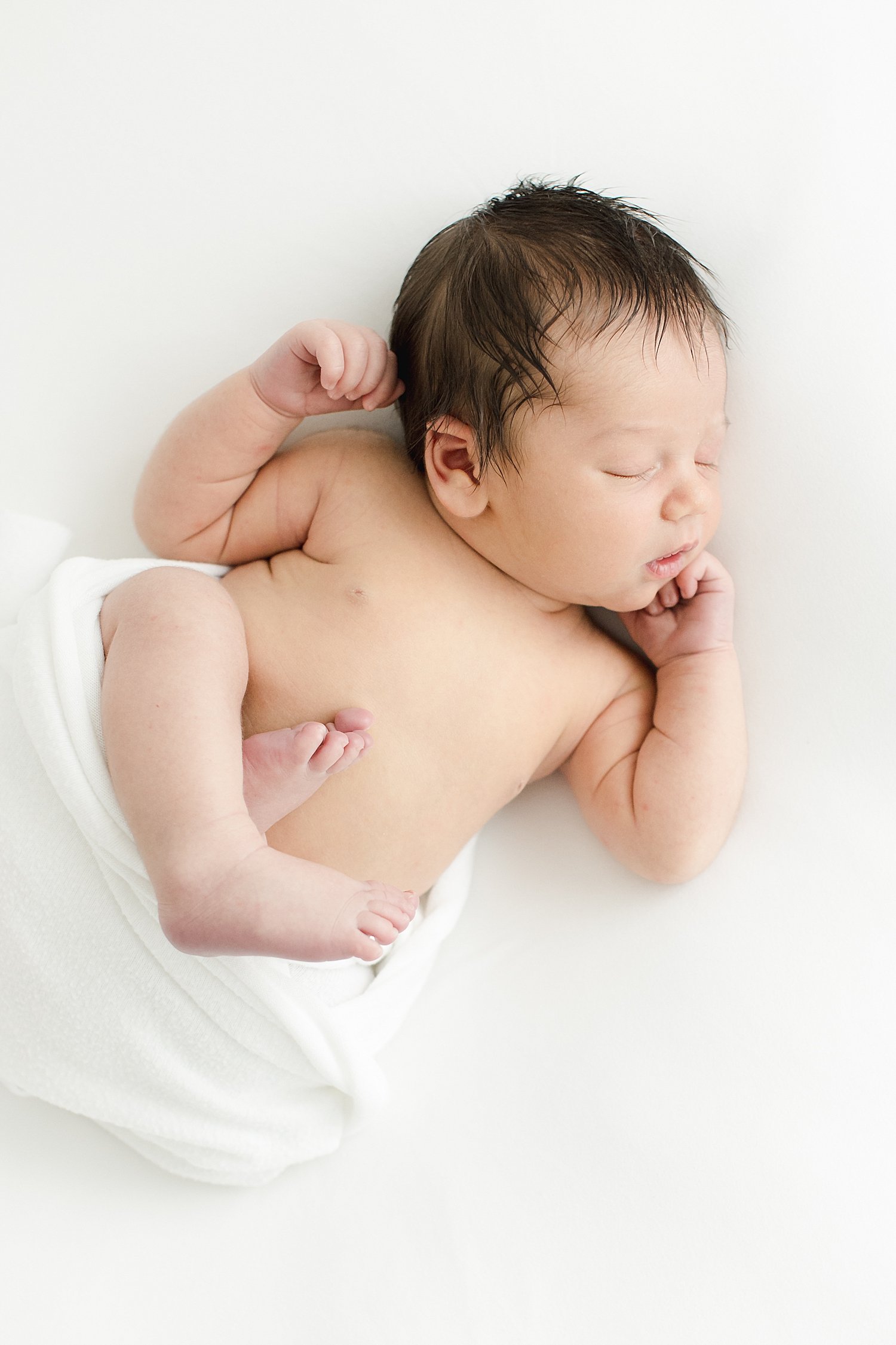 Newborn baby boy curled up for photos | Kristin Wood Photography