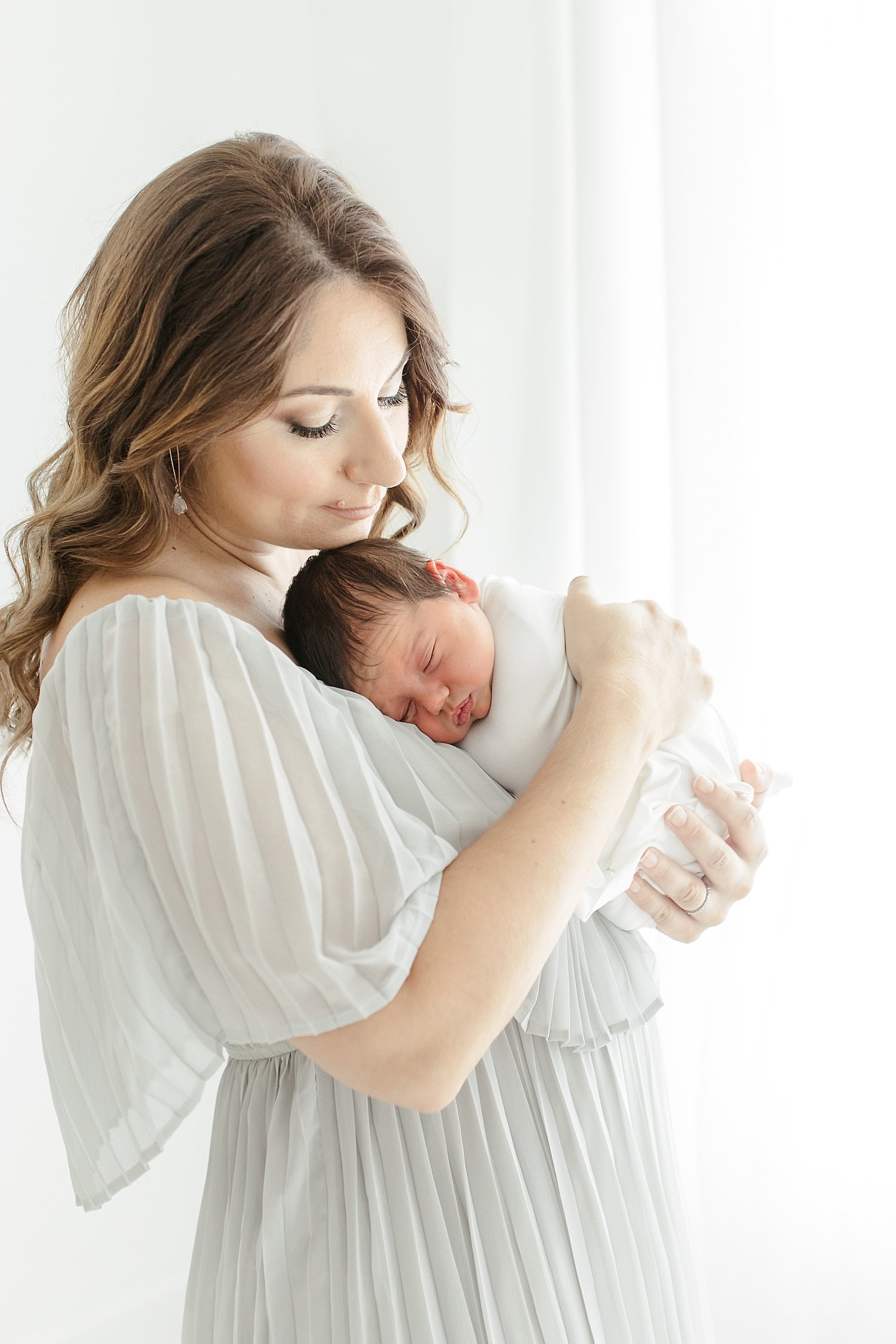 Mom holding her newborn son | Kristin Wood Photography