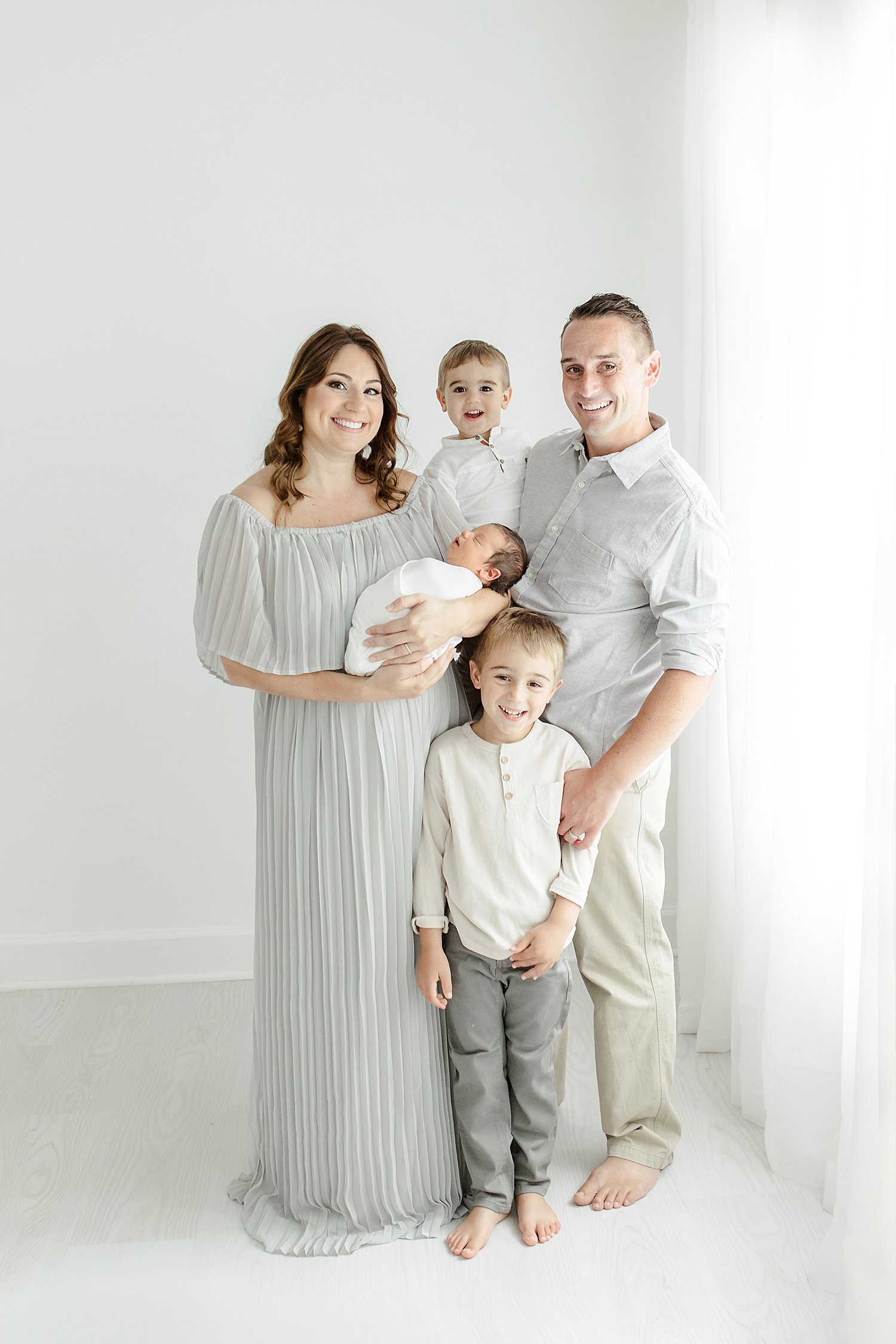 Mom and Dad with their three boys | Kristin Wood Photography