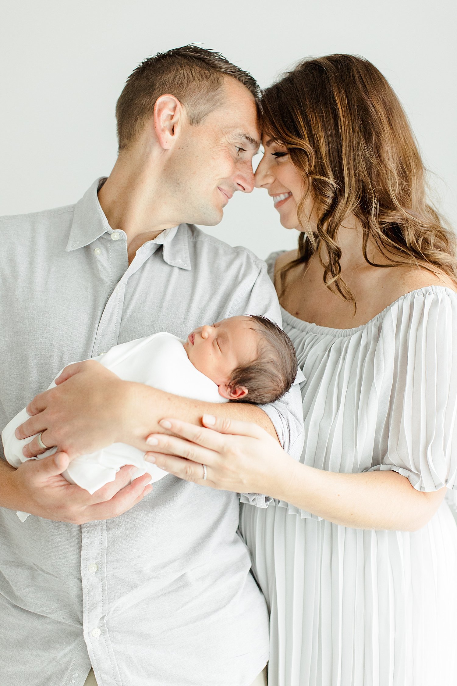 Parents holding their newborn son | Kristin Wood Photography