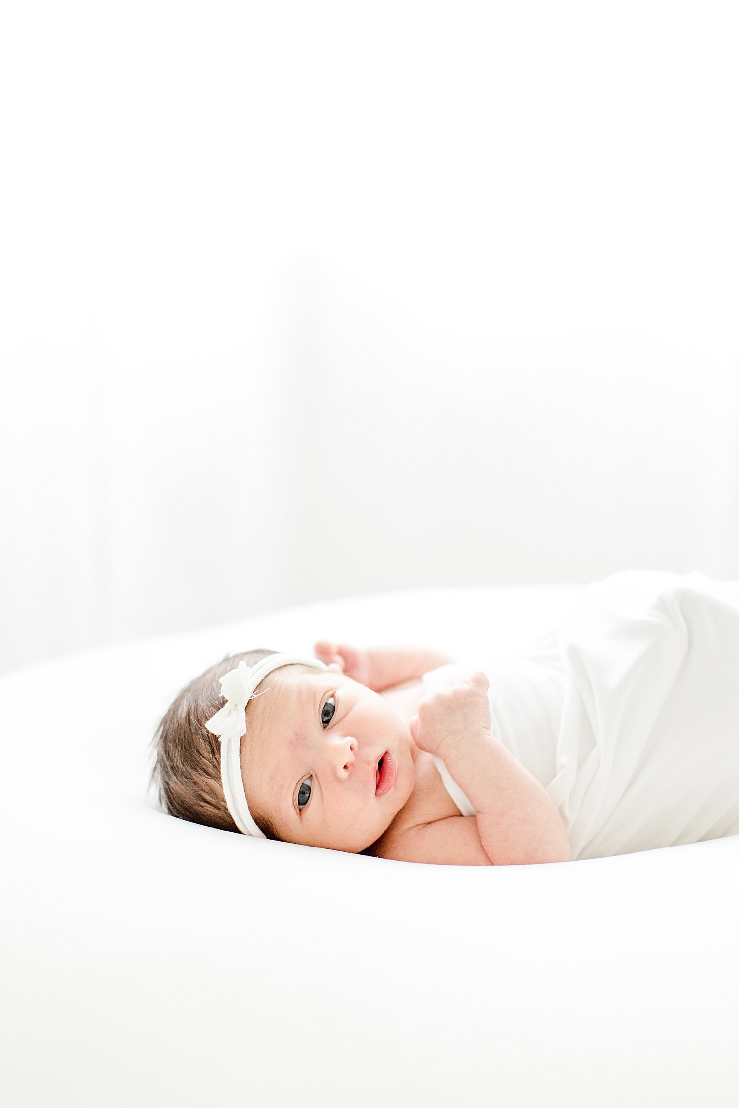 Newborn baby girl awake during photoshoot | Kristin Wood Photography