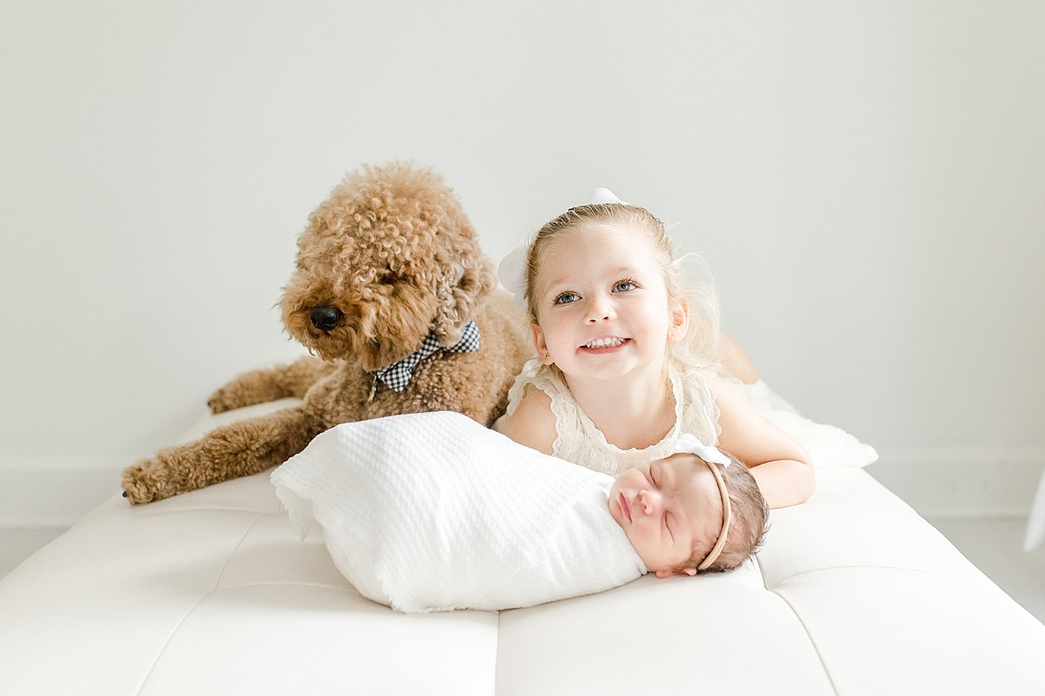 Family dog with two girls during newborn photoshoot | Kristin Wood Photography