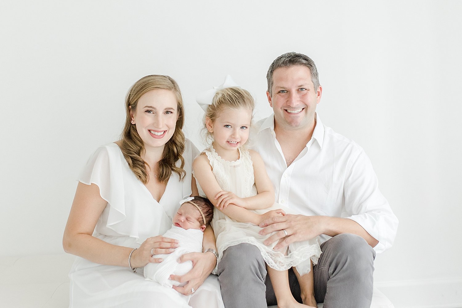 Family newborn session for baby girl in studio with Kristin Wood Photography