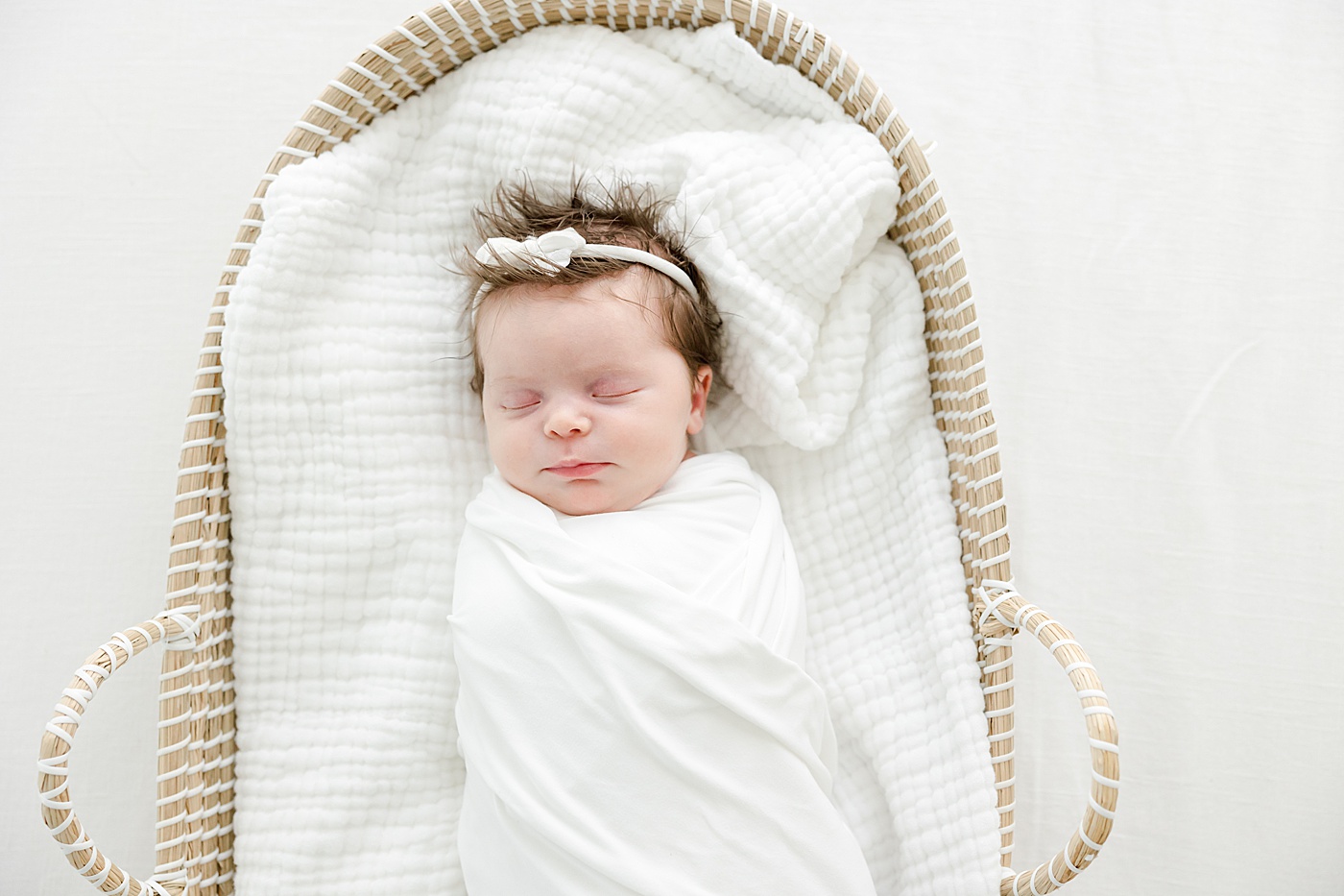 Baby swaddled in Moses basket for newborn photos | Kristin Wood Photography