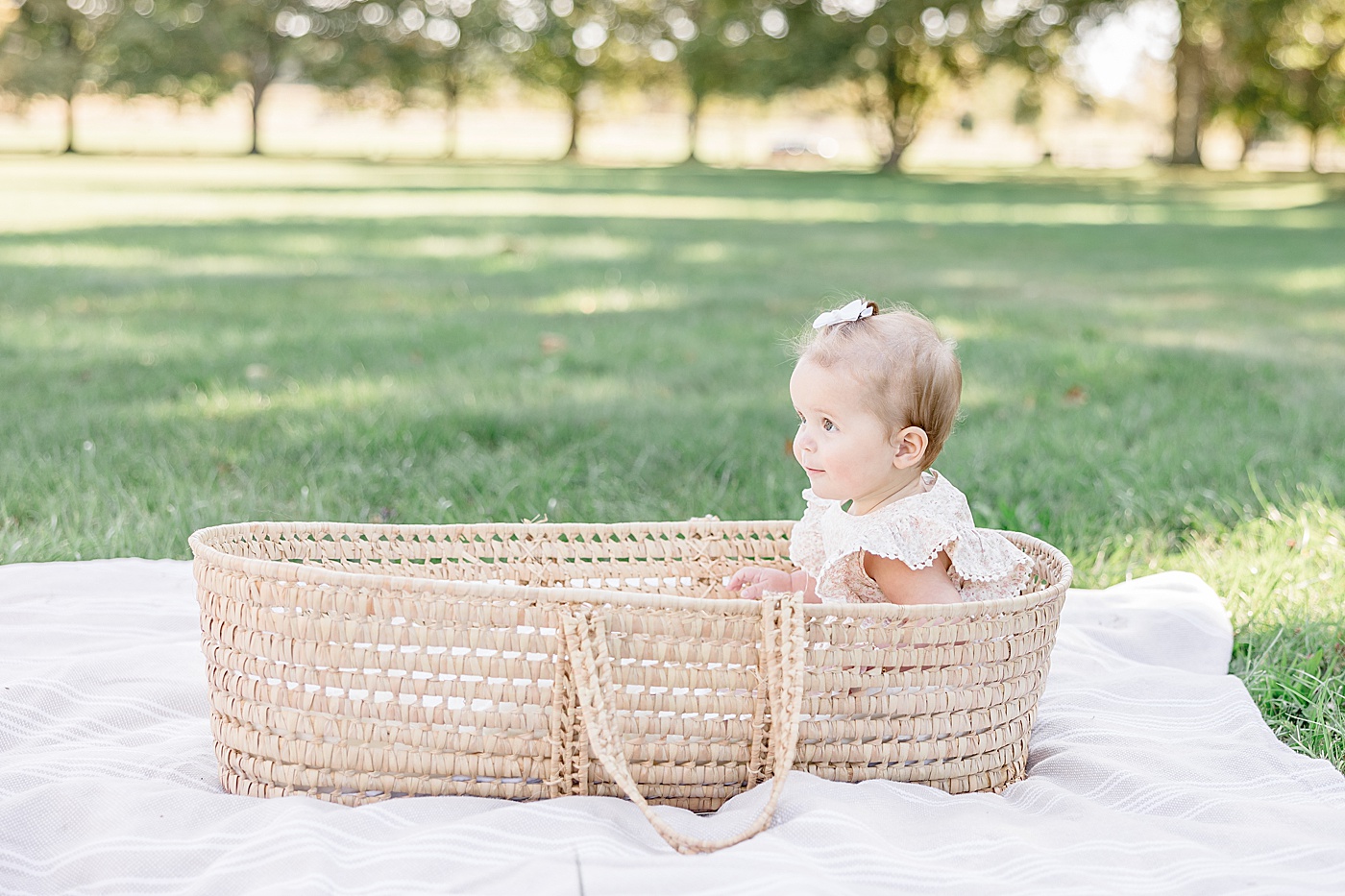 7 month old baby girl in Moses basket | Kristin Wood Photography