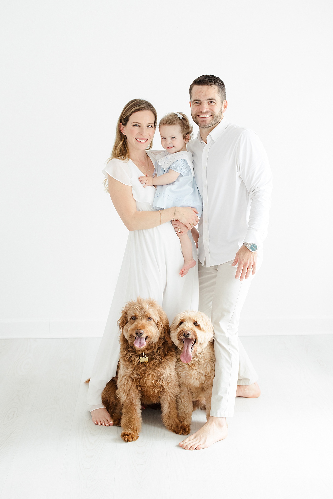 One year old celebrating her first birthday with parents and two family dogs | Kristin Wood Photography
