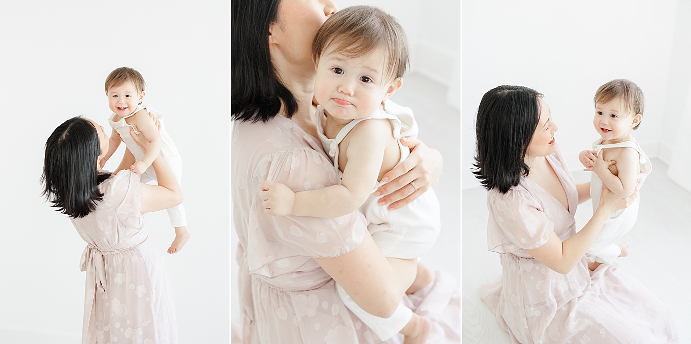 Mom holding her son during first birthday photoshoot | Kristin Wood Photography