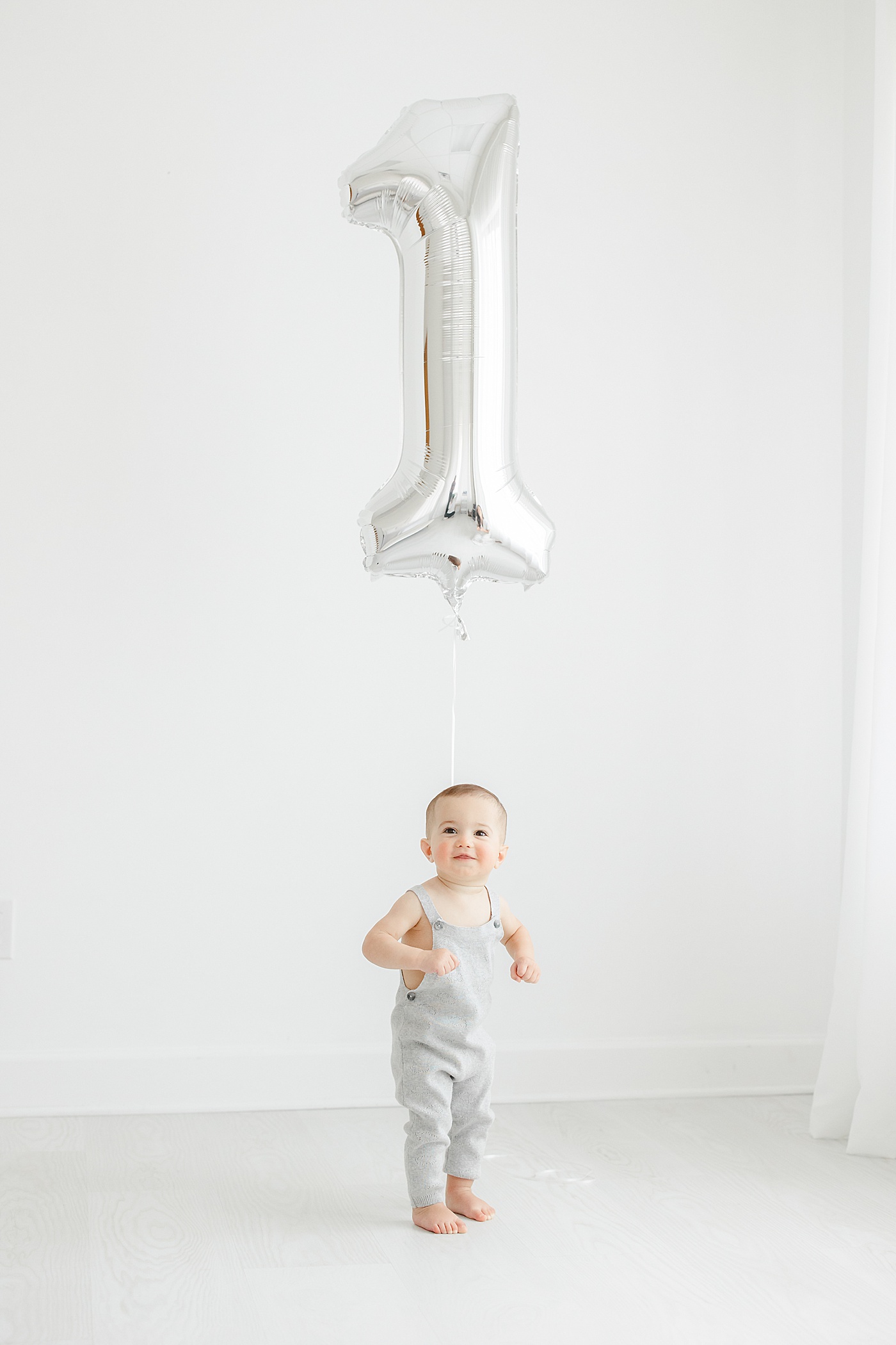 First birthday photoshoot with big ONE balloon in studio with Kristin Wood Photography.
