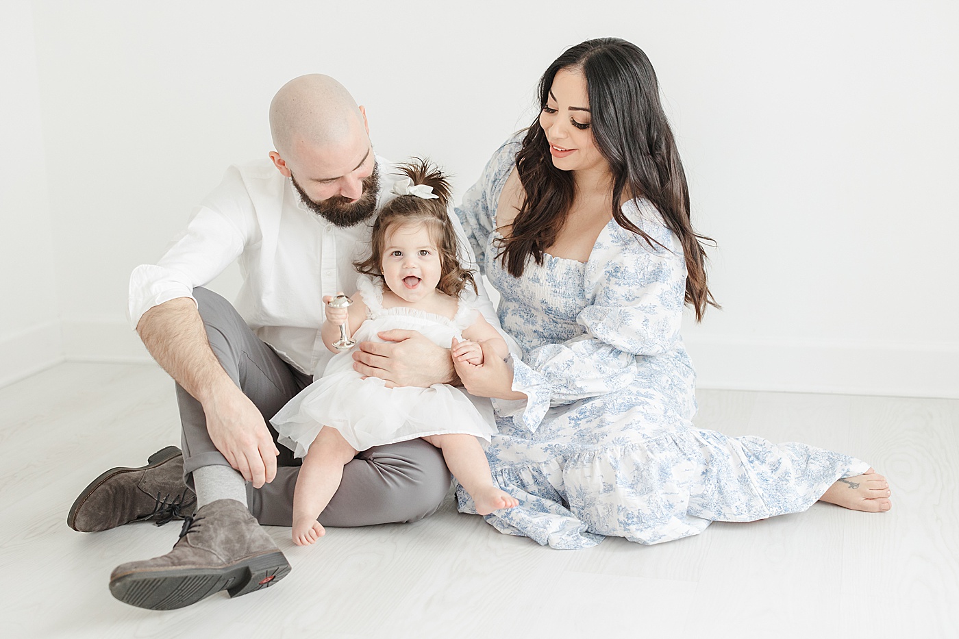 Mom and Dad holding their one year old daughter | Kristin Wood Photography