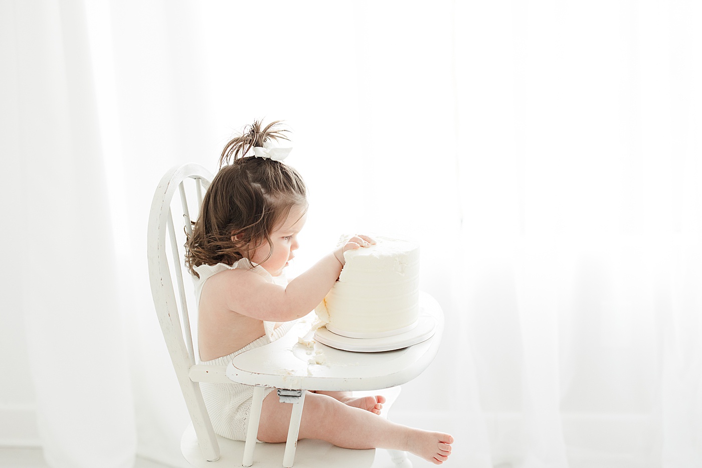 Cake smash during first birthday session with Kristin Wood Photography.