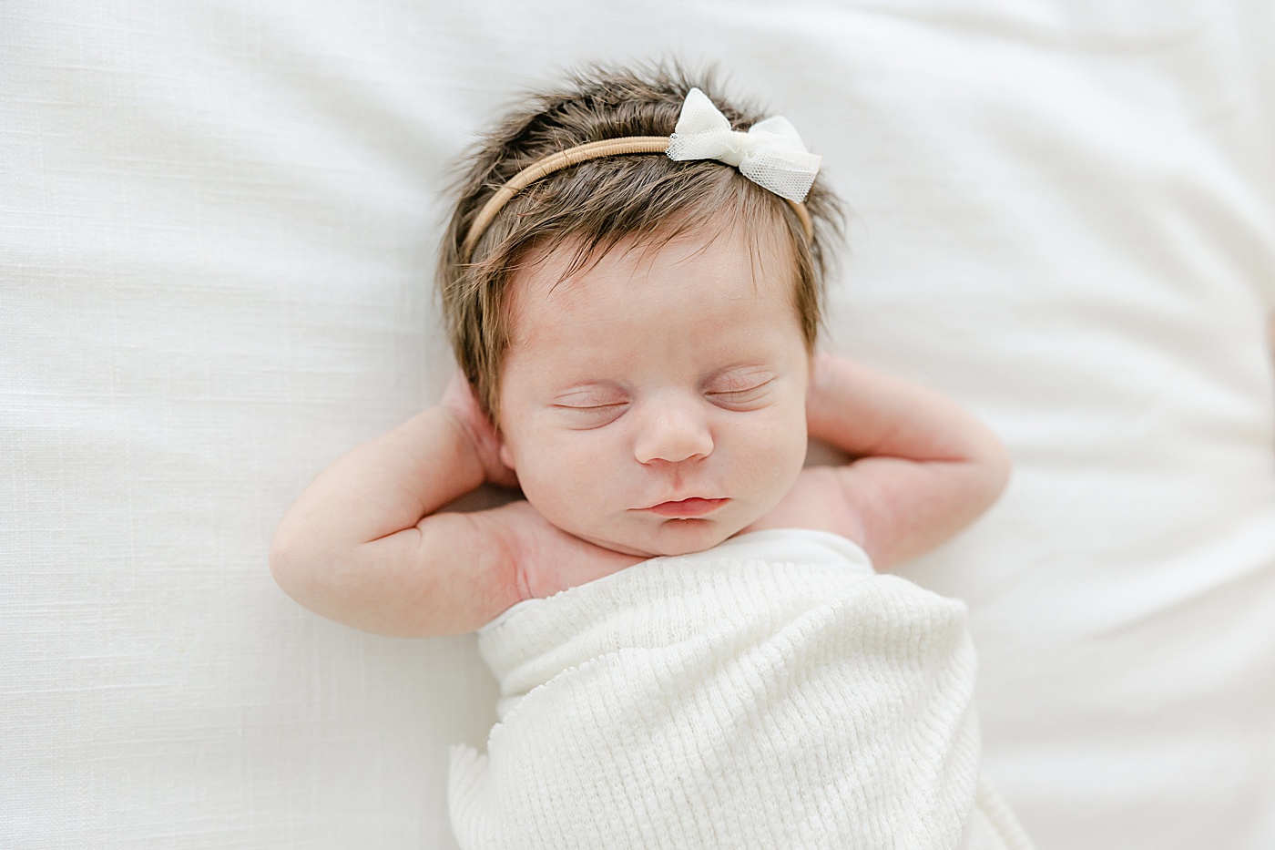 Baby girl sleeping during newborn photos with Kristin Wood Photography.