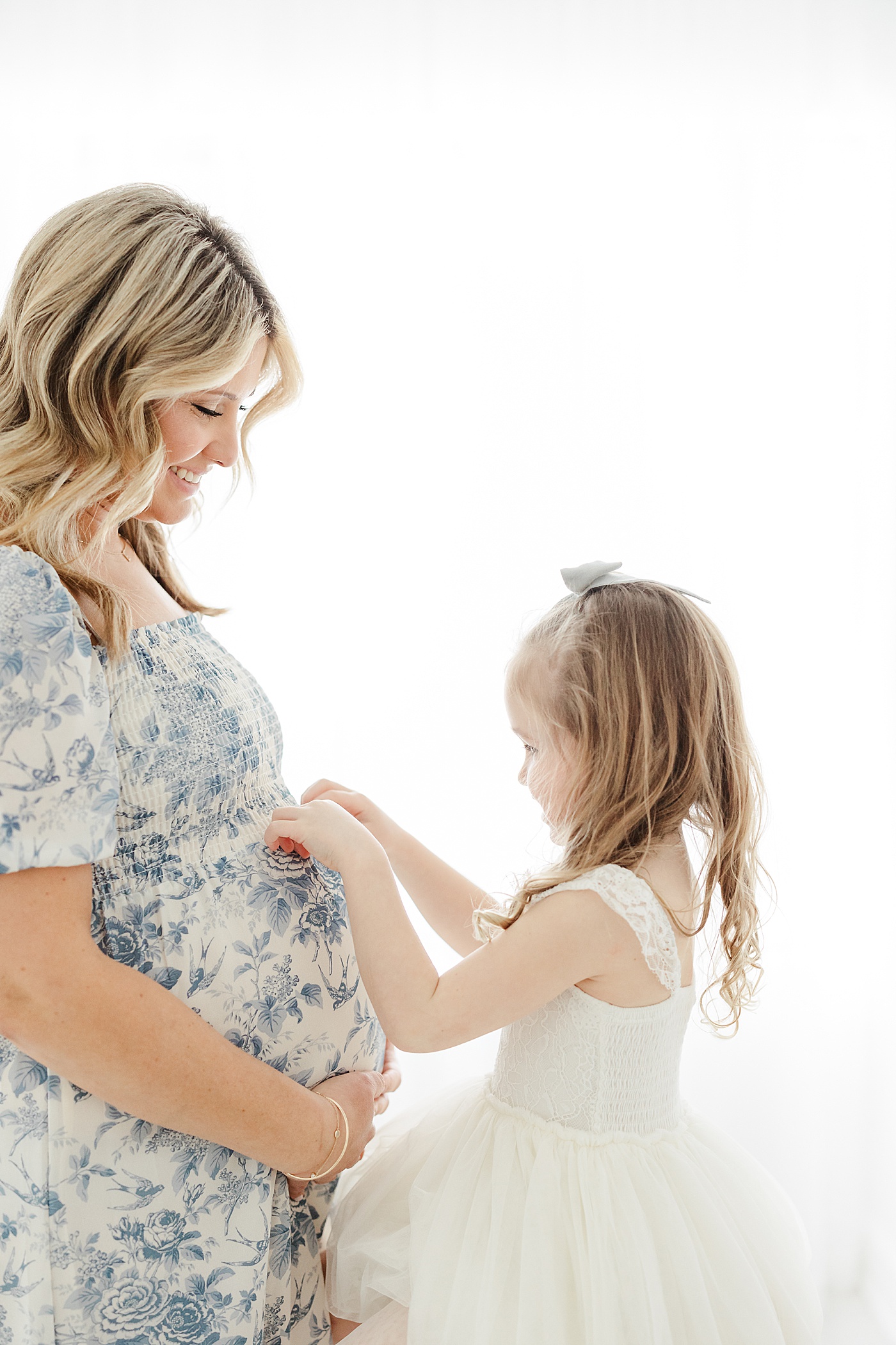 Mother-daughter maternity photoshoot in Westport, CT studio with Kristin Wood Photography.