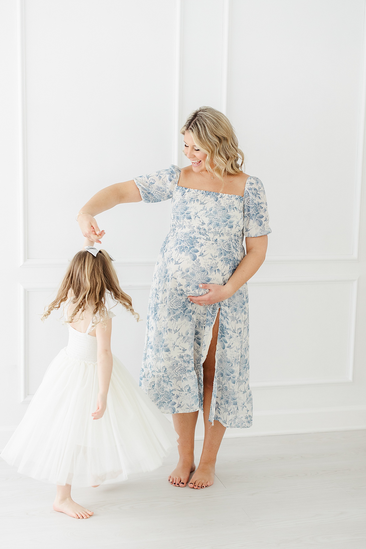 Mom dancing with her daughter during maternity photoshoot | Kristin Wood Photography